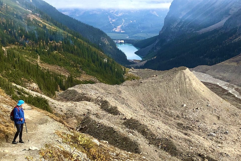 Don’t look back, unless the view is worth it. Linda Barnard admires the view of Lake Louise and the Fairmont Chateau Lake Louise from the Plain of Six Glaciers trail.