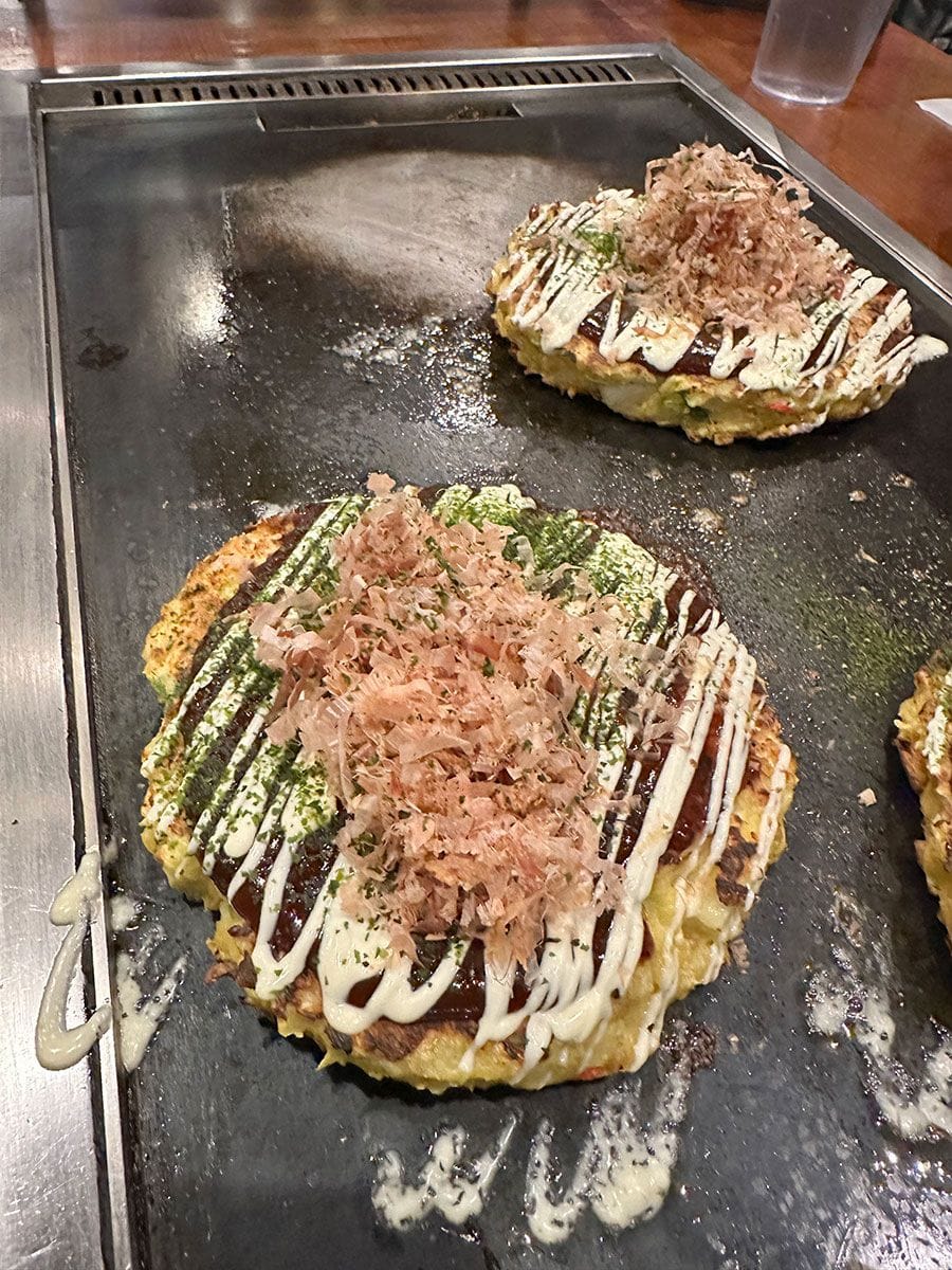 Yukari restaurant has been serving thick, savory cabbage pancakes, called okonomiyaki, in Kuromon Ichiba since 1953