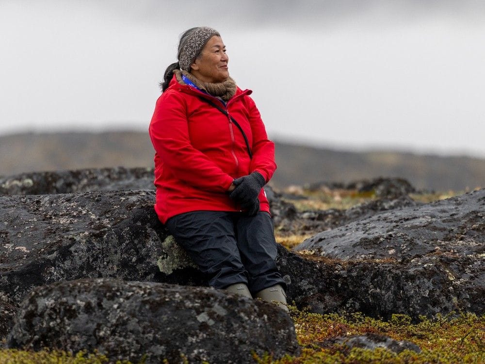 Former Greenland Prime Minister Aleqa Hammond pauses during a hike on Disko Island, Greenland