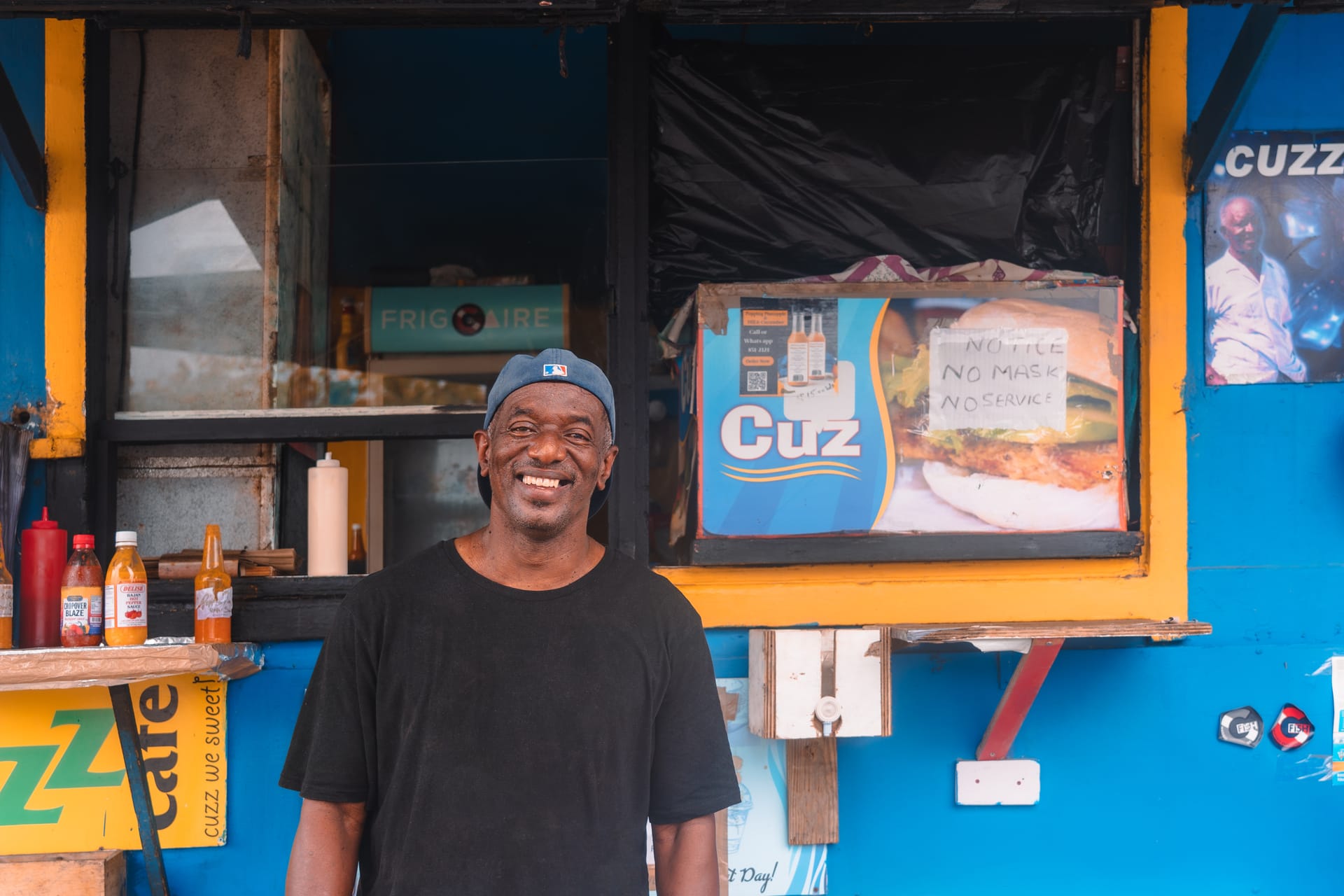 David Murray stands in front of Cuzz Cafe Fish Stand, his blue fish stand on Pebbles Beach. 